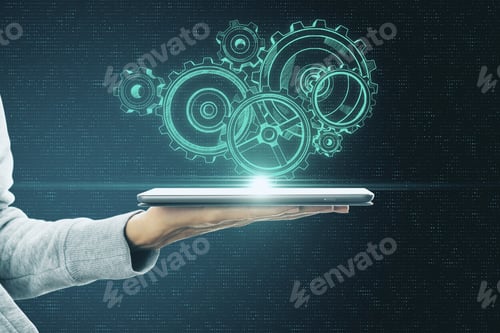 Preview: Hand Holding Tablet With Drawing Glowing Cogwheel Sketch. Device And System Concept