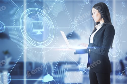 Preview: Thoughtful Young European Businesswoman With Laptop Standing In Blurry Office Interior With