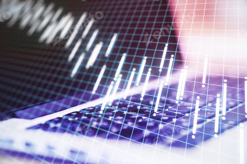 Preview: Close Up Of Laptop On Desktop With Stock Charts Hologram And Digital Grid. Trade And Financial
