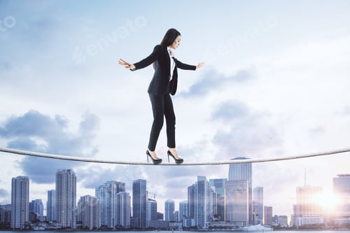 Preview: Side View Of Young European Businesswoman Balancing On City And Sky Background. Equilibrium And