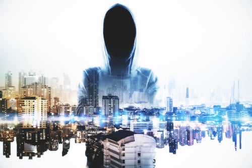 Preview: Hacker Standing On Abstract City Background. Hacking And Malware Concept. Double Exposure
