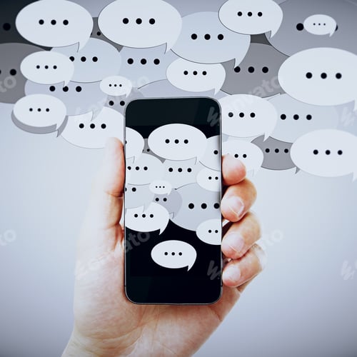 Preview: Hand Holding Smartphone With Speech Icons. Communication Concept