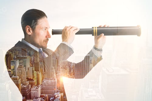Preview: Side View Of Young European Businessman Using Telescope On Blurry City Background. Vision And