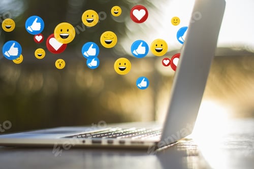 Preview: Close Up Of Laptop Computer On Desktop With Social Media Icons. Blurry Background. Communication