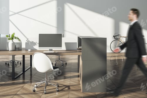 Preview: Businessman Walking In Modern Hipster Coworking Office Interior With Empty Mock Up Computer Screen