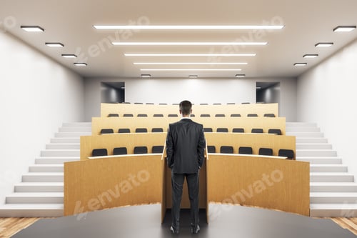 Preview: Young Businessman Standing In Modern Auditorium Interior. Presentation Concept.