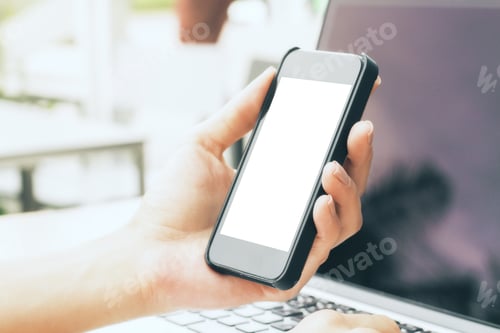 Preview: Side View Of Girl'S Hands Holding White Cellphone And Using Notebook. Technology Concept. Mock Up