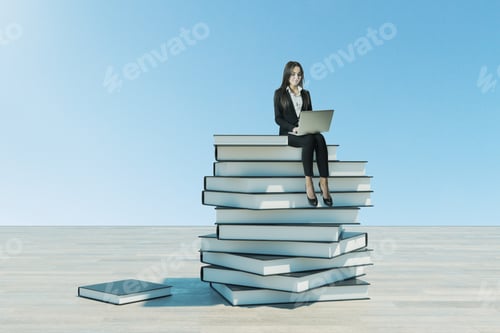 Preview: Education And Vision Concept. Businesswoman With Laptop Sitting On Pile Of Books.