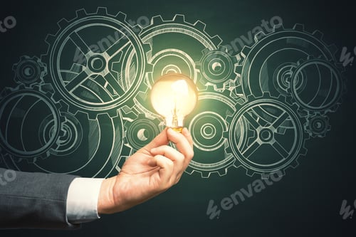 Preview: Hand Holding Luminous Lamp With Drawing Gears And Cogs. Teamwork And Idea Concept