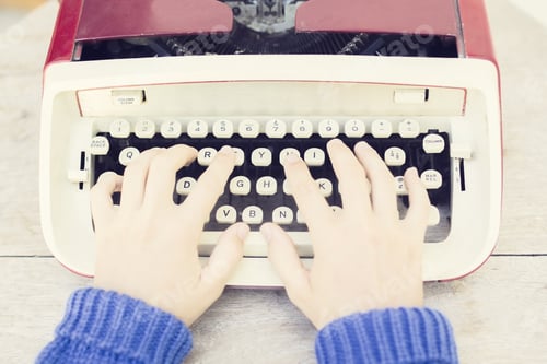 Preview: Girl With Old Style Typewriter On The Wooden Table