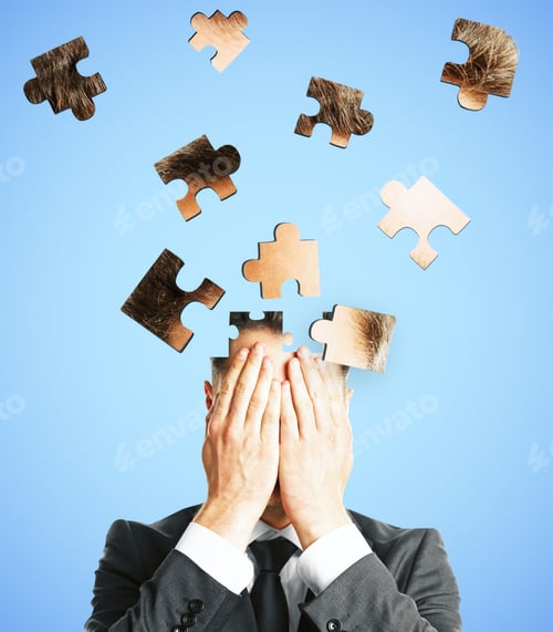 Preview: Puzzle Headed Businessman On Light Background. Confusion And Jigsaw Concept