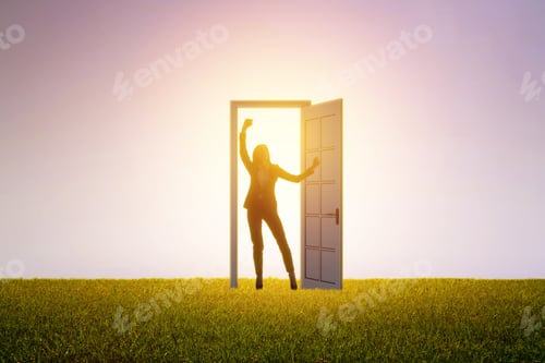 Preview: Successful Female Standing In Front Of Bright Door In Abstract Interior With Concrete Wall, Grass