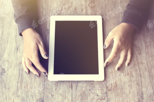Preview: Girl Hands And Digital Tablet On A Wooden Table
