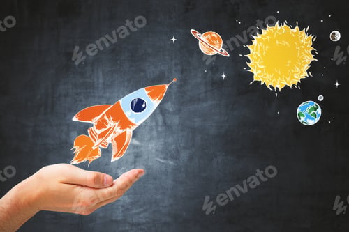 Preview: Hand Holding Creative Rocket Sketch On Concrete Wall Background. Startup And Exploration Concept