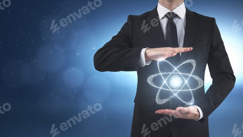 Preview: Businessman Holding Glowing Atom On Blurry Background. Science And Technology Concept
