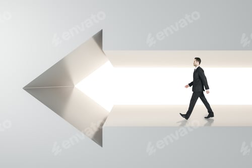 Preview: Side View Of Young Businessman Walking In Arrow Wall. Success And Career Concept.