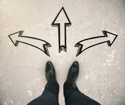 Preview: Different Direction Concept With Businessman Feet And Three Arrow Sketches On Aged Light Concrete