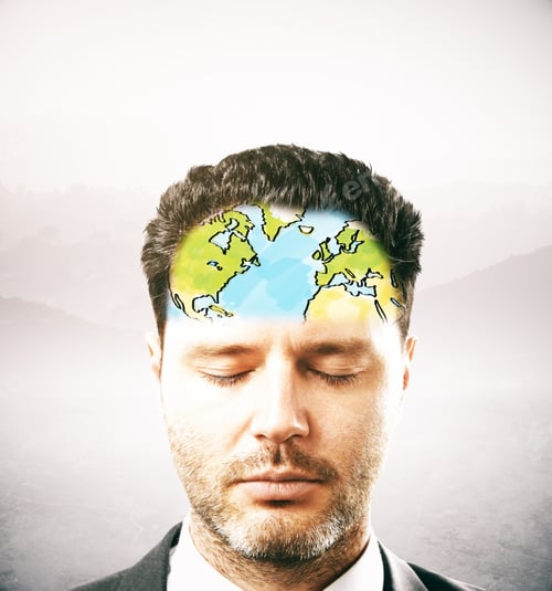 Preview: Portrait Of Thoughtful Businessman With Map On Forehead. Light Background
