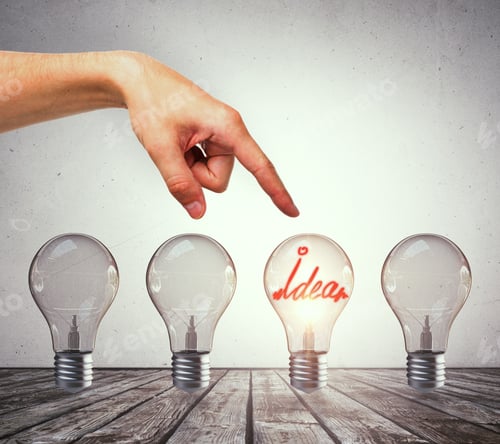Preview: Female Hand Pointing At Creative Row Of Illuminated Light Bulbs. Choice, Idea And Leader Concept