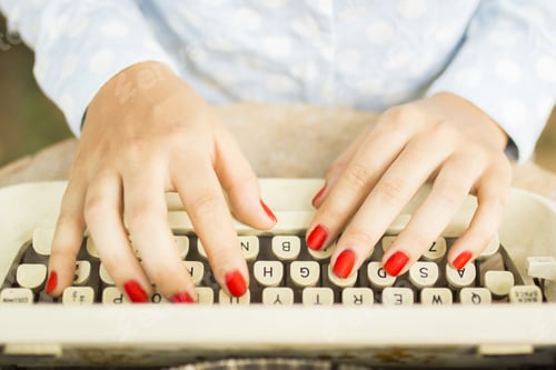 Preview: Woman Typing On A Typewriter