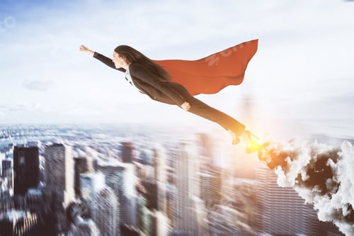 Preview: Creative Super Hero Businesswoman On Blurry City Background. Leadership And Confidence Concept