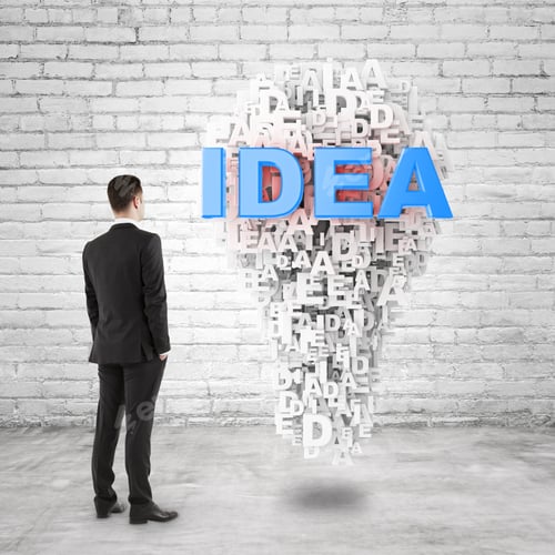 Preview: Young Businessman In Brick Room And Looking To Idea Symbol