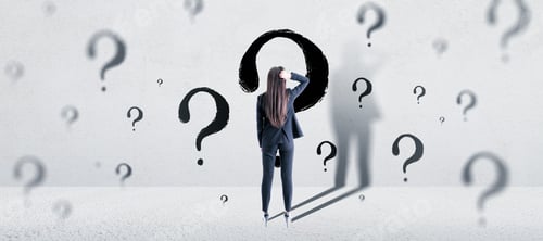 Preview: Solution And Doubt Concept. Attractive Young European Businesswoman Standing In Concrete Interior