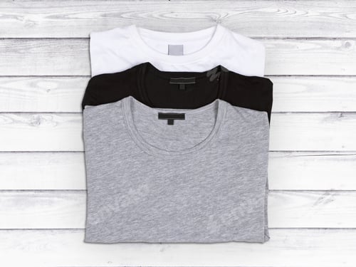 Preview: Three Blank T-Shirts On A White Wooden Background
