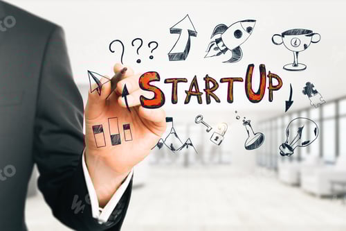 Preview: Businessman Drawing Startup Sketch In Modern White Office Interior. Start Up And Growth Concept.