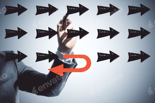 Preview: Businessman Drawing Black Arrow On Blue Wall Background. Leadership And Way Concept