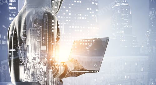 Preview: Side View Of Hacker Using Laptop On Blurry Night City Background. Malware And Technology Concept