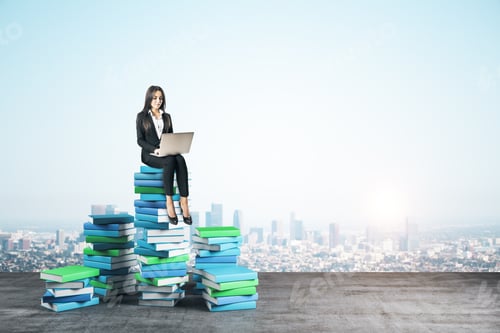 Preview: Young Businesswoman With Laptop Computer Sitting On Books On City Background. Growth, Knowledge And