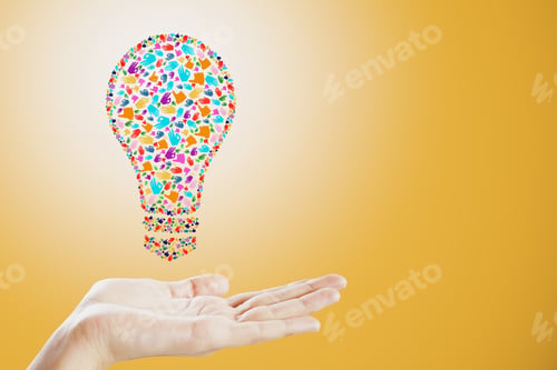 Preview: Held Hand Gesture Lightbulb On Orange Background. Communication, Community, Inspire, Idea And