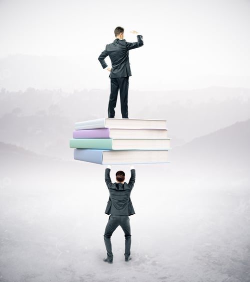 Preview: Businesspeople Holding And Standing On Book Stack. Abstract Landscape Background. Education And