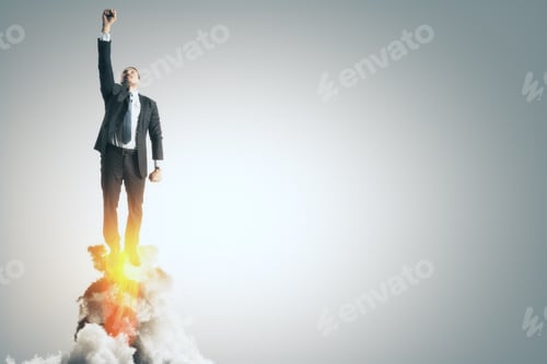 Preview: Launching Young Businessman With Flames On Gray Background. Startup And Entrepreneur Concept