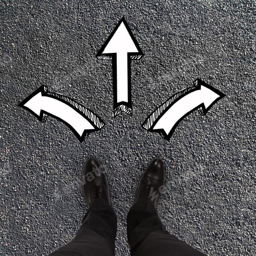 Preview: Pair Of Feet Standing On A Tarmac Road With White Arrows