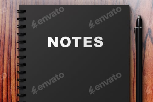 Preview: Black Diary With Notes On A Wooden Table