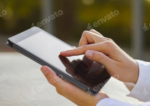 Preview: Man Presses Digital Tablet At Sunrise