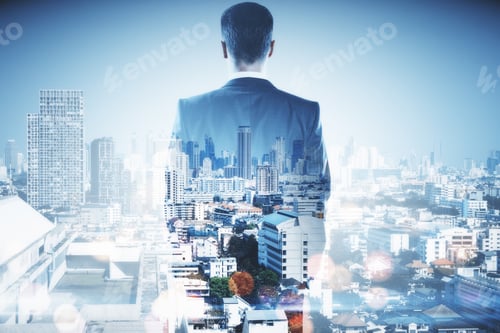 Preview: Back View Of Businessman On Blurry Bokeh City Background. Success And Ambition Concept. Double