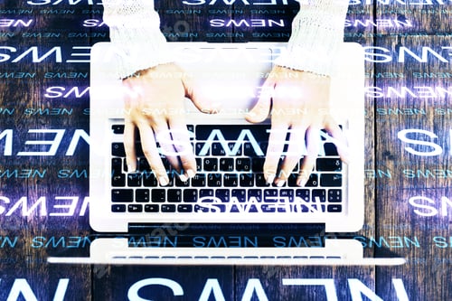 Preview: Top View Of Hands Typing On Laptop With News Lines On Wooden Desktop Background. Media And