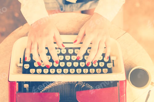 Preview: Girl At The Table Typing On A Typewriter, Vintage Photo Effect