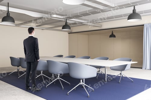 Preview: Side View Of Thoughtful Young Businessman Standing In Modern Conference Room Interior With