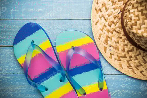 Preview: Colorful Beach Flip Flop And Straw Hat On Wooden Background