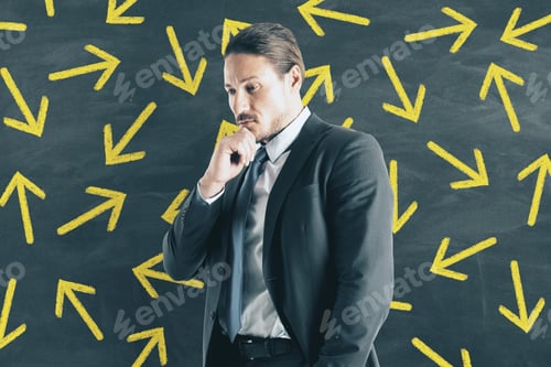 Preview: Portrait Of Thoughtful Young European Businessman With Arrows. Way And Path Concept