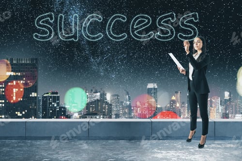 Preview: Young Businesswoman Writing Abstract Success Word On Concrete Rooftop Background With Blurry Night
