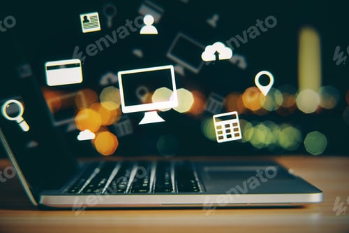 Preview: Side View And Close Up Of Notebook With Glowing Media Icons On Bokeh Desktop Background. Technology