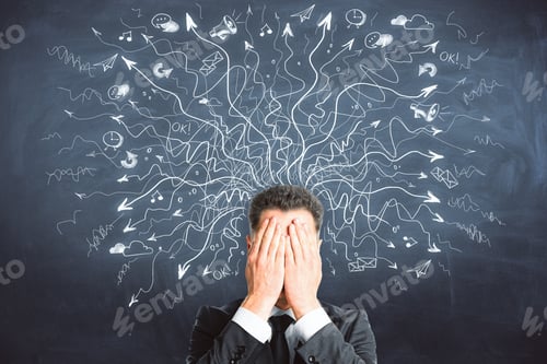 Preview: Businessman Covering Face On Chalkboard Background With Drawn Arrows. Risk And Confusion Concept