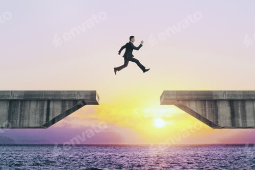 Preview: Businessperson Jumping Over Concrete Gap On Beautiful Sunset Background. Success And Challenge