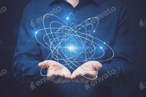Preview: Businessman Holding Atom On Dark Background. Science Concept