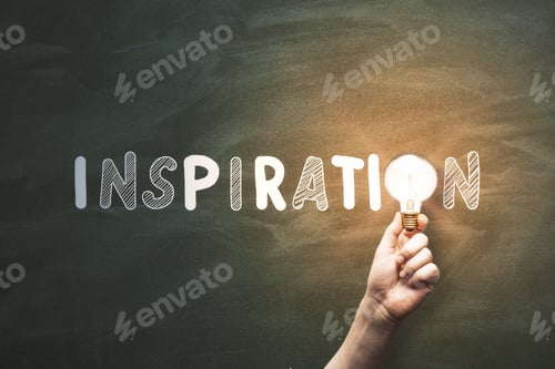 Preview: Hand Holding Glowing Lamp On Chalkboard Wall Background With Text. Inspiration, Success, Idea And